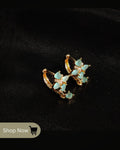 Aqua blue stone floral earrings for women – gold-plated party wear jewelry.
